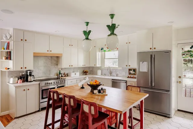 a kitchen with a table and chairs in it