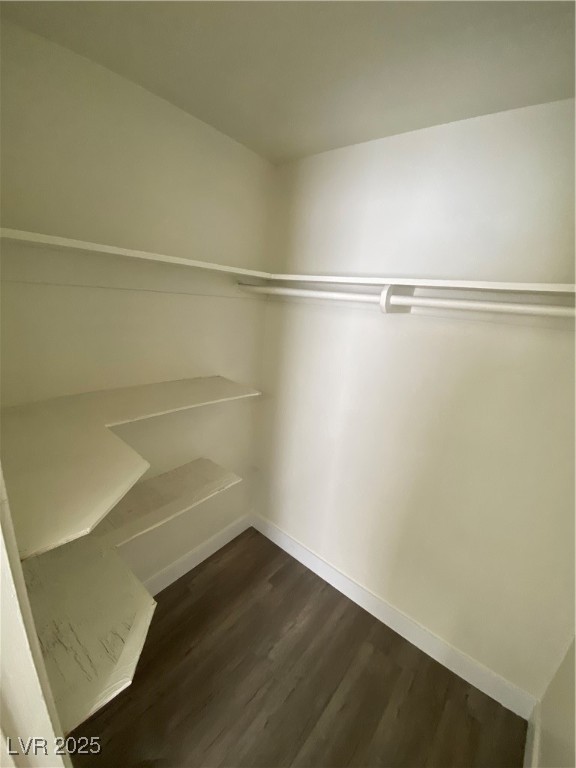 1711 Santa Paula Drive, Unit B Las Vegas, NV 89104 - Photo 11 of 17 Spacious closet featuring dark wood-style flooring