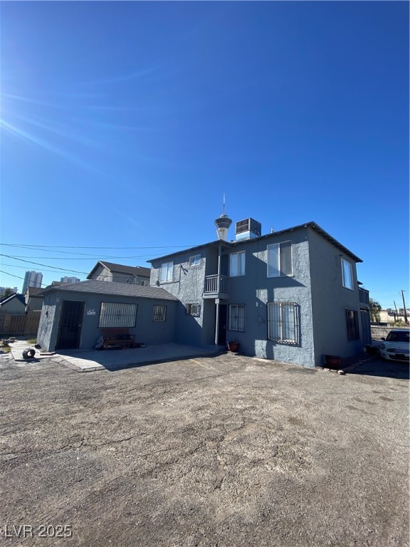 1711 Santa Paula Drive, Unit B Las Vegas, NV 89104 - Photo 15 of 17 Back of property with a balcony and stucco siding