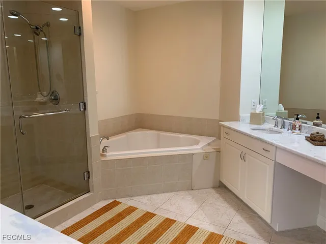 a bathroom with a bathtub and a sink