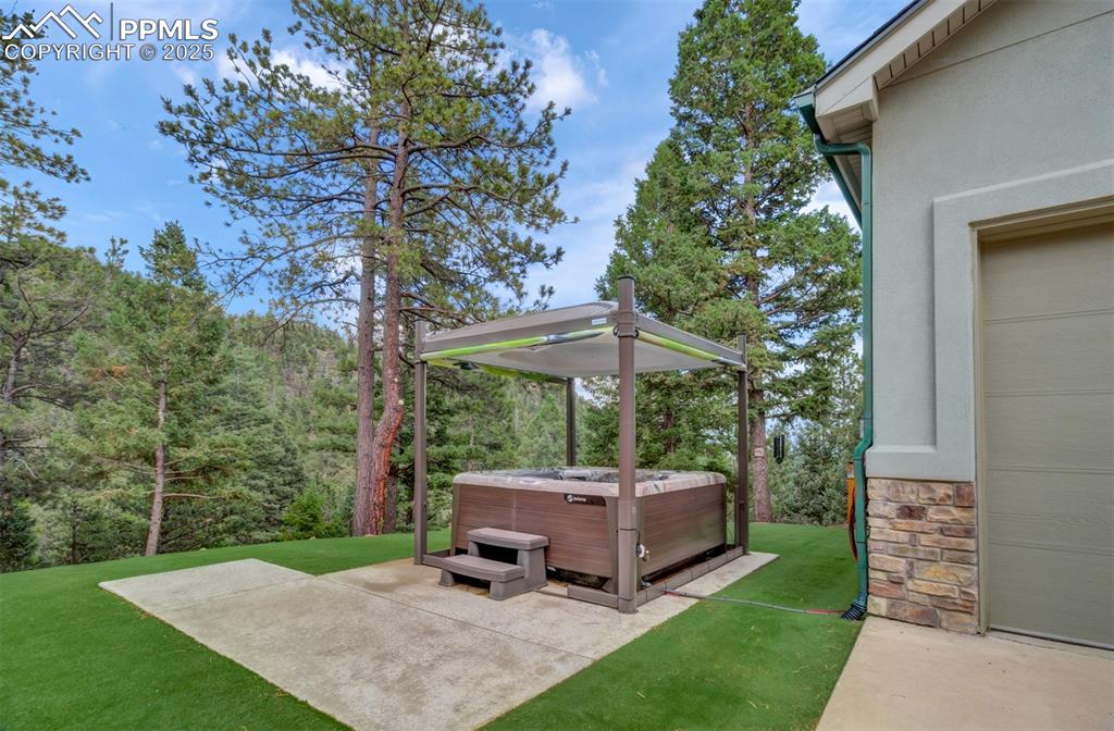 6104 Coffee Pot Road Manitou Springs, CO 80829 - Photo 2 of 49 a view of a backyard with a garden and trees