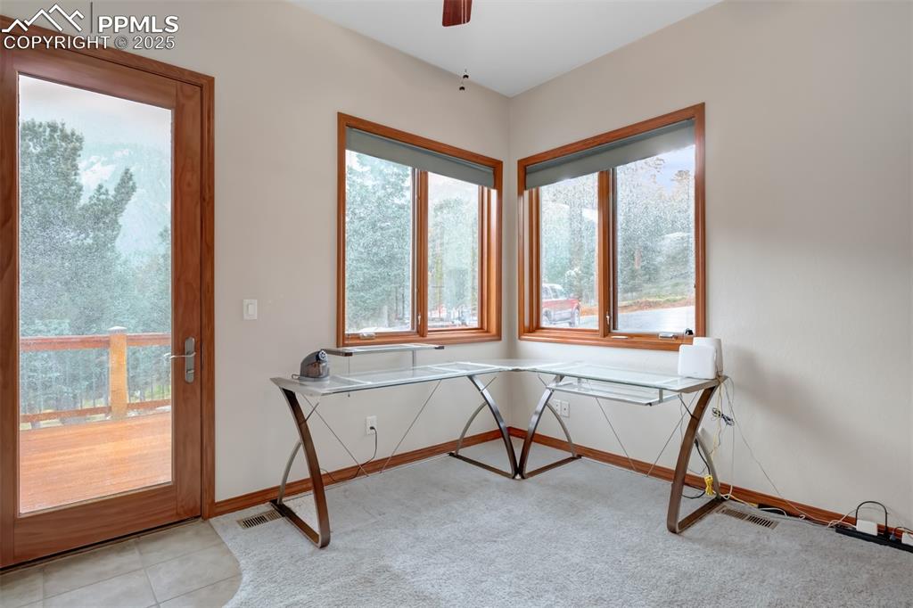 6104 Coffee Pot Road Manitou Springs, CO 80829 - Photo 21 of 49 a living room with furniture and a window