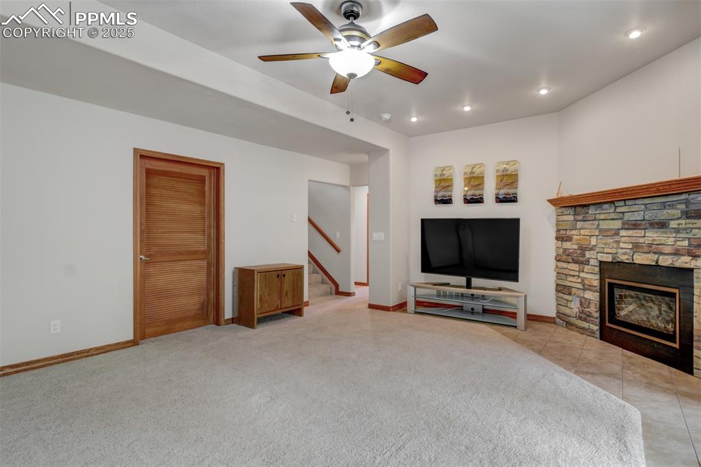 6104 Coffee Pot Road Manitou Springs, CO 80829 - Photo 26 of 49 a living room with furniture and a flat screen tv
