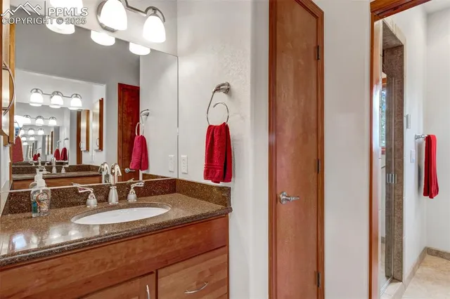 a bathroom with a double vanity sink and a mirror