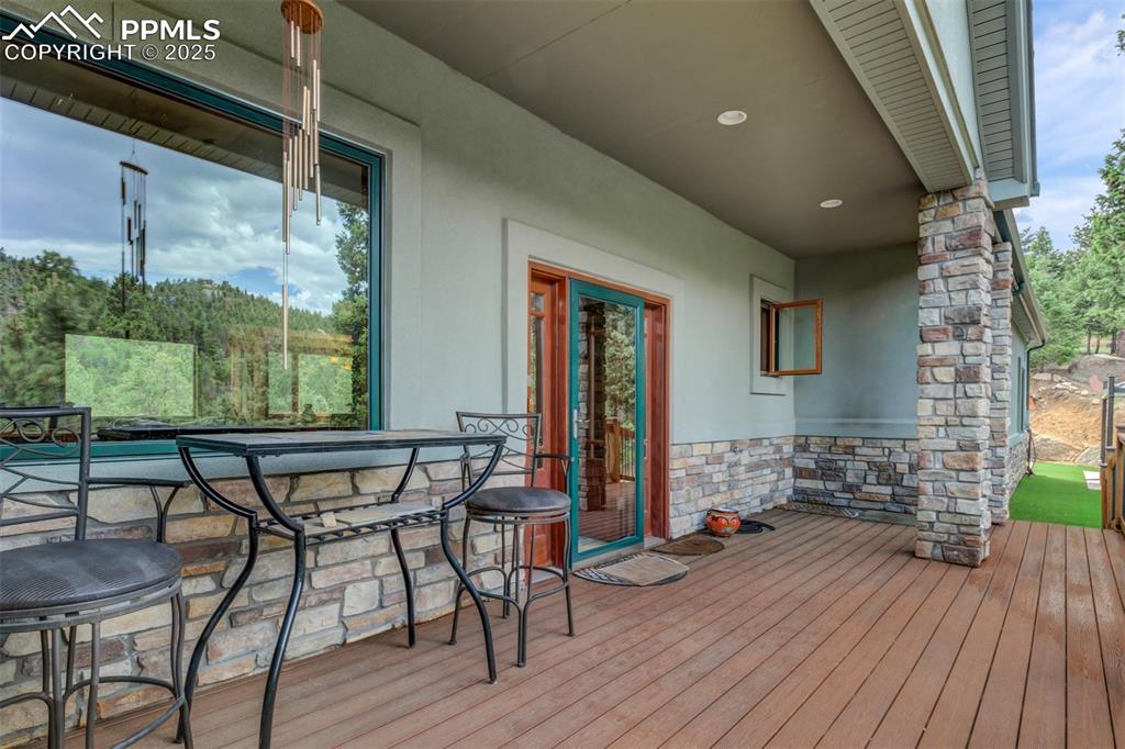 6104 Coffee Pot Road Manitou Springs, CO 80829 - Photo 4 of 49 a dining room with furniture and wooden floor