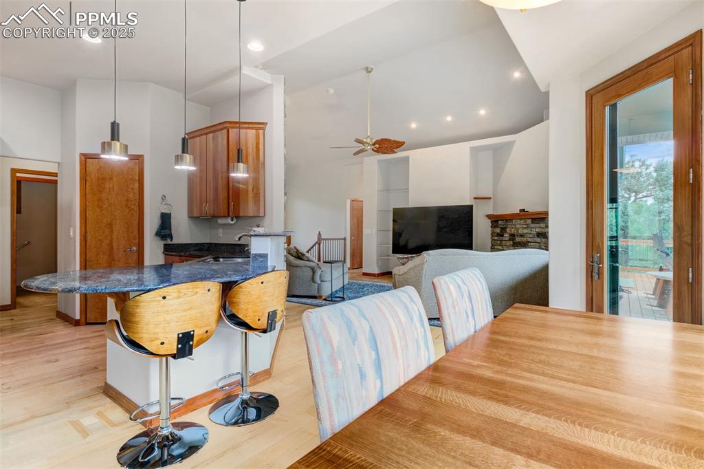 6104 Coffee Pot Road Manitou Springs, CO 80829 - Photo 9 of 49 a living room with furniture a flat screen tv and a large window