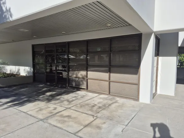 a bathroom with a shower and a sink