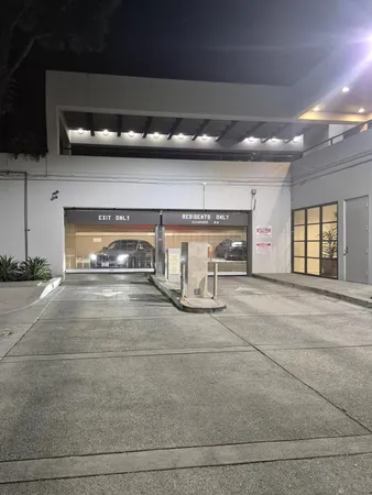a living room with lots of furniture and a large window