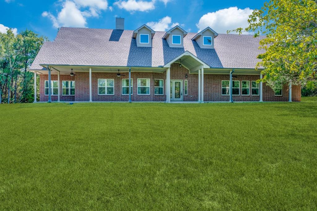 Undisclosed Address Valley View, TX 76272 - Photo 1 of 12 a front view of a house with a garden