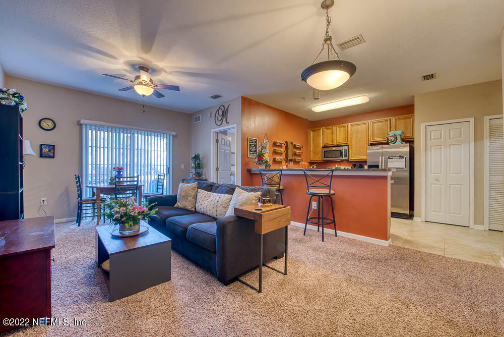 8226 Green Parrot Road, Unit 105 Jacksonville, FL 32256 - Photo 1 of 17 living room