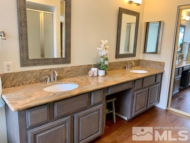 1551 Bramble Court Reno, NV 89509 - Photo 11 of 30 a bathroom with double sink and a mirror
