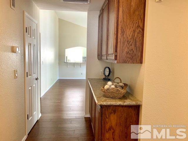 1551 Bramble Court Reno, NV 89509 - Photo 17 of 30 a kitchen with granite countertop sink and cabinets
