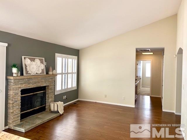 1551 Bramble Court Reno, NV 89509 - Photo 3 of 30 a view of a livingroom with wooden floor and a fireplace