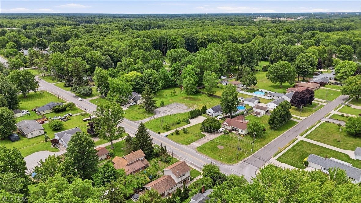 7474 Avon Belden Road North Ridgeville, OH 44039 - Photo 3 of 6 Aerial perspective showcasing a residential area with extensive mature tree coverage