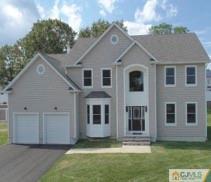 5 Hausserman Road Sayreville, NJ 08872 - Photo 1 of 1 a front view of a house with a yard