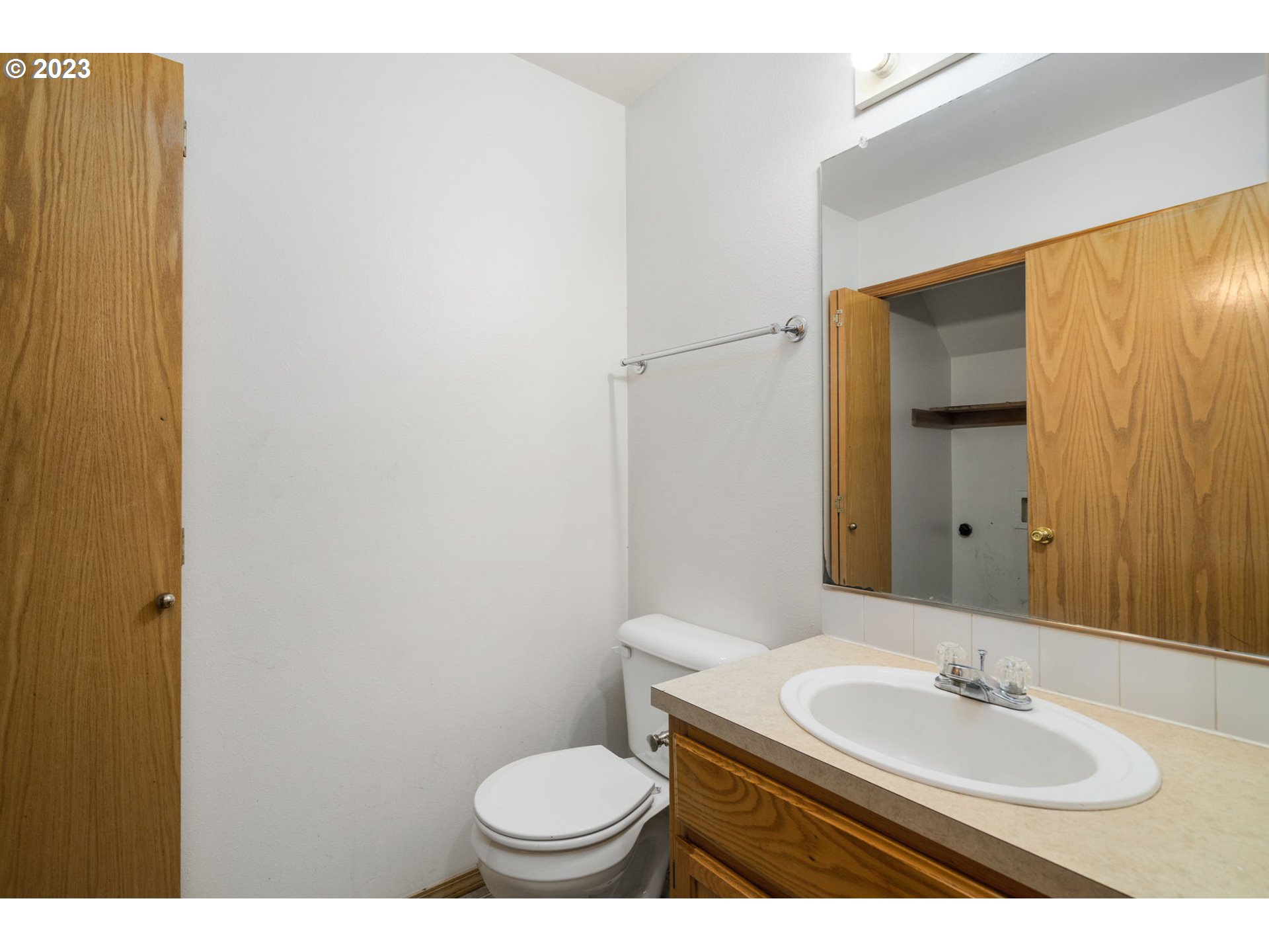 12315 Southeast Boise Street Portland, OR 97236 - Photo 13 of 23 a bathroom with a sink and a mirror