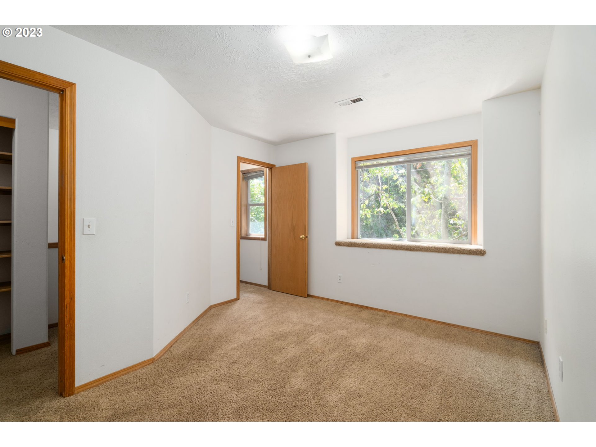 12315 Southeast Boise Street Portland, OR 97236 - Photo 15 of 23 a view of an empty room with a window
