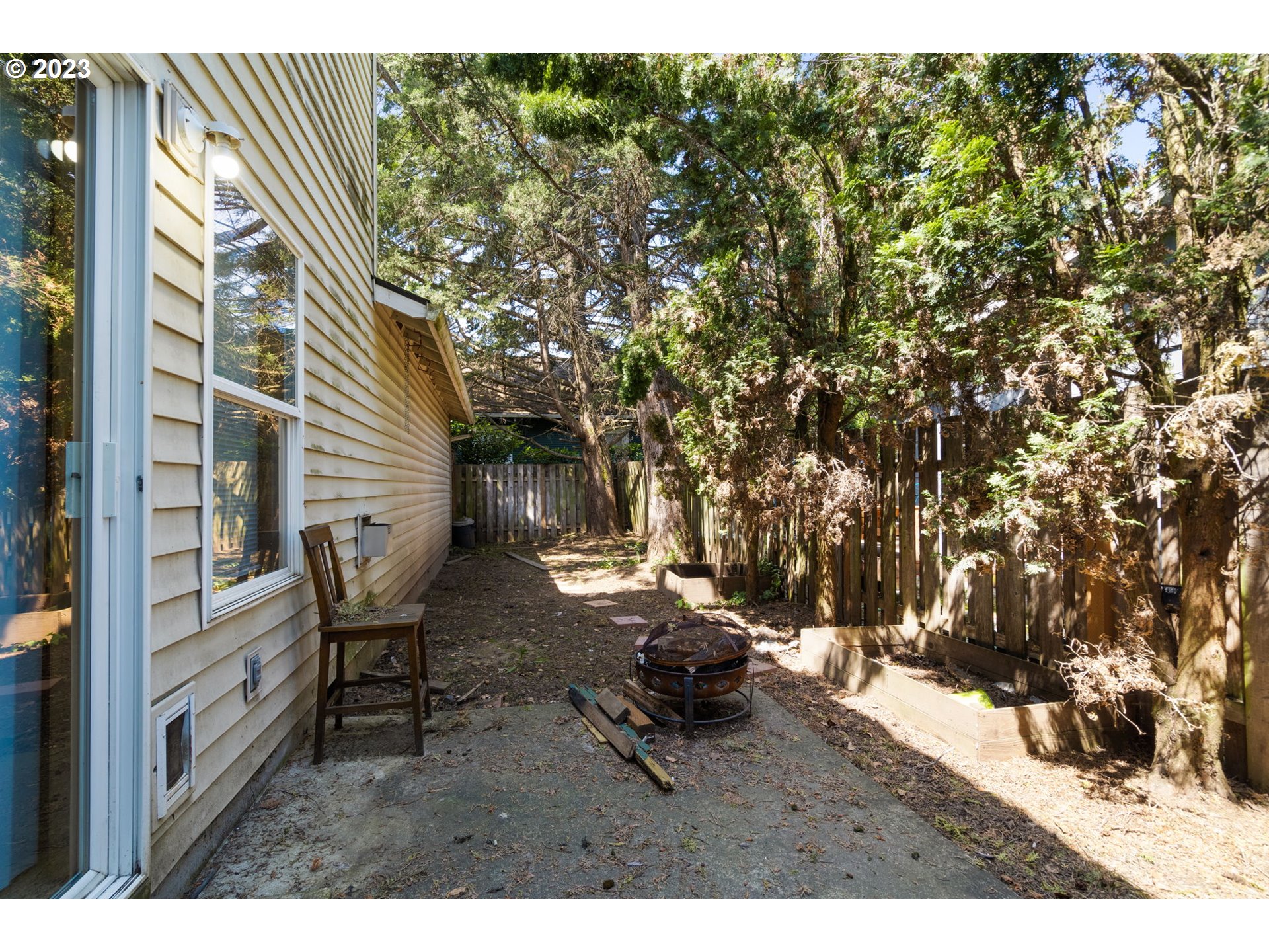 12315 Southeast Boise Street Portland, OR 97236 - Photo 23 of 23 a backyard of a house with table and chairs