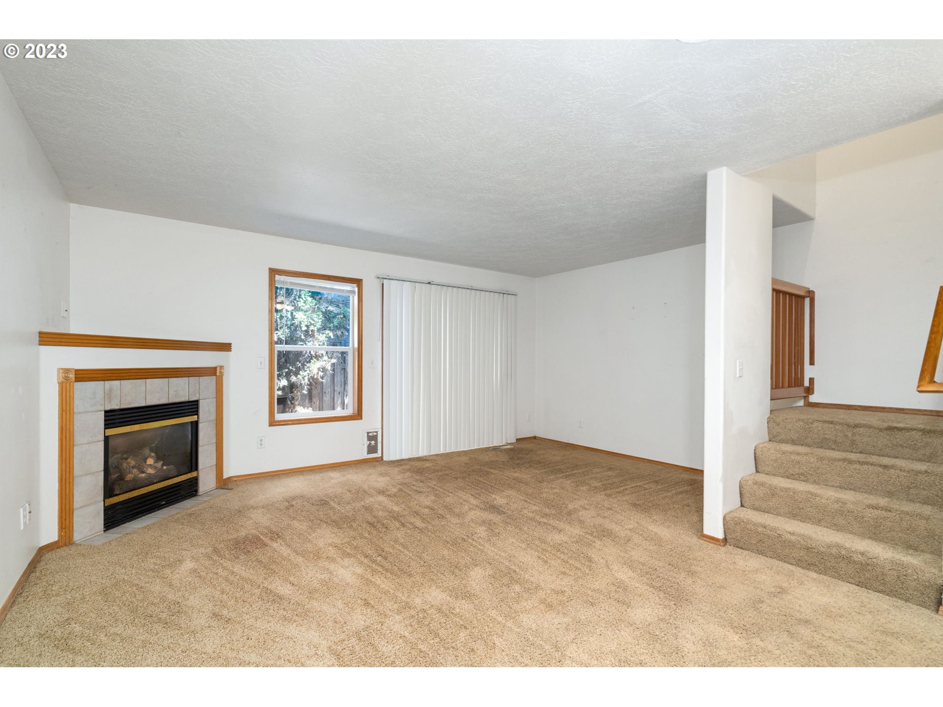 12315 Southeast Boise Street Portland, OR 97236 - Photo 6 of 23 a view of empty room with fireplace