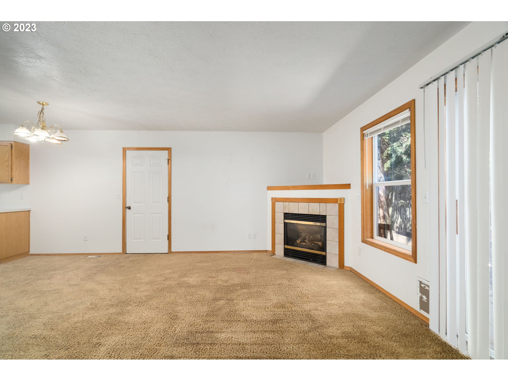 12315 Southeast Boise Street Portland, OR 97236 - Photo 7 of 23 a view of an empty room with a window