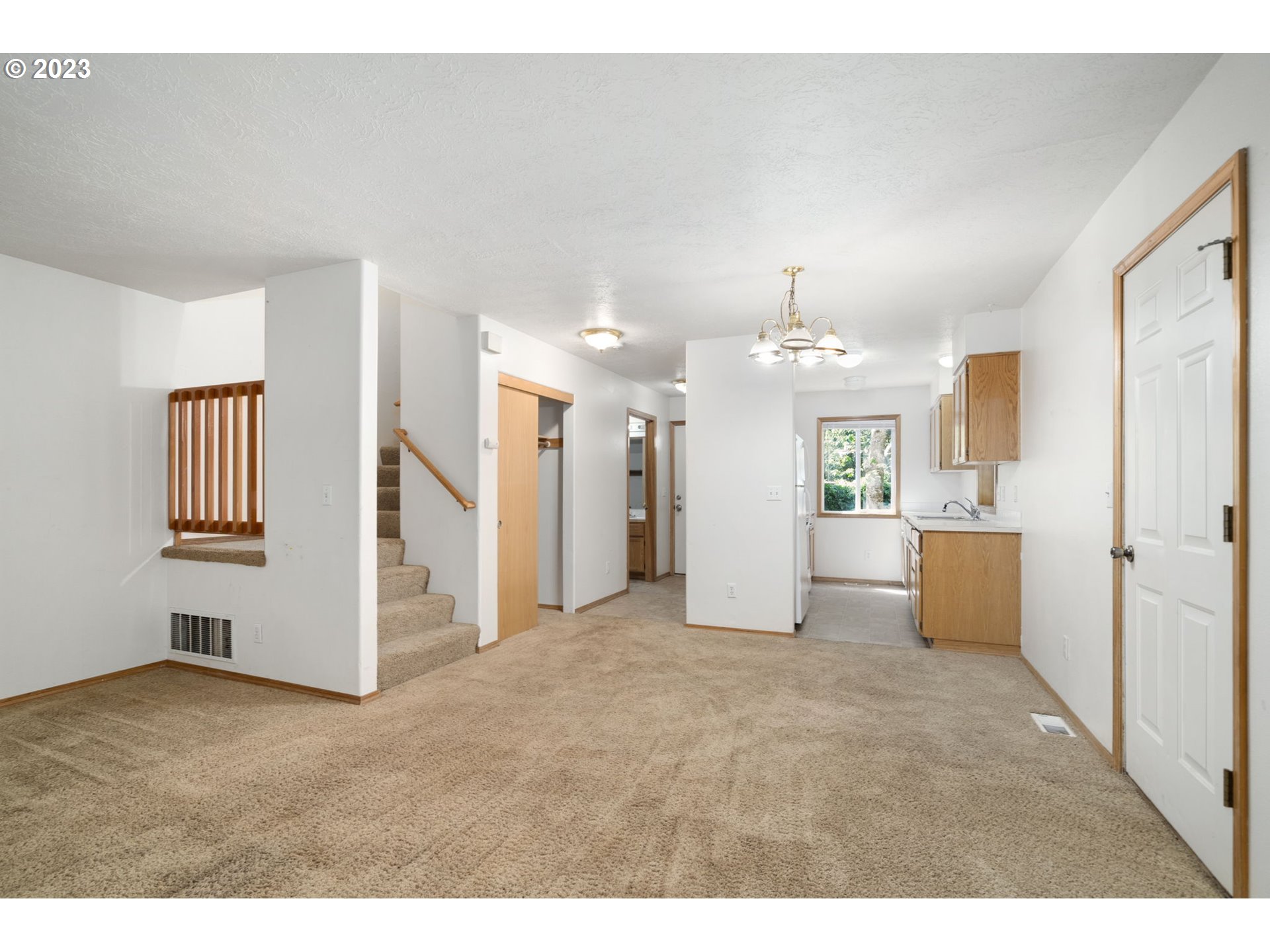 12315 Southeast Boise Street Portland, OR 97236 - Photo 8 of 23 a view of a big room with kitchen and windows