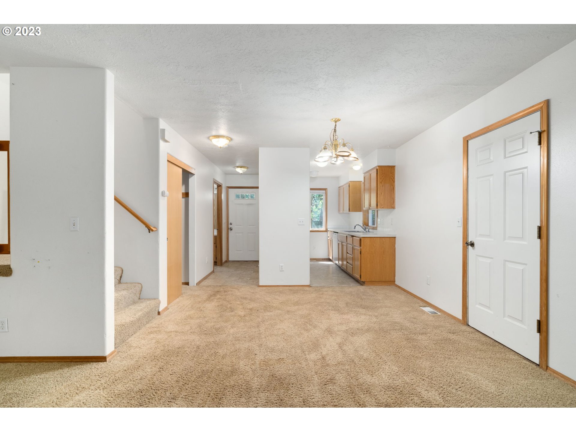 12315 Southeast Boise Street Portland, OR 97236 - Photo 9 of 23 a view of a kitchen with refrigerator and a sink