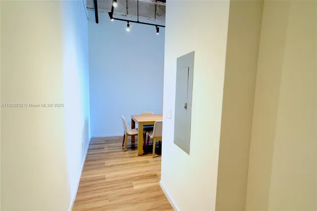 a view of a bedroom from a hallway