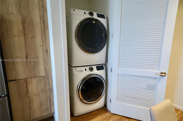 a view of a hallway with washer and dryer