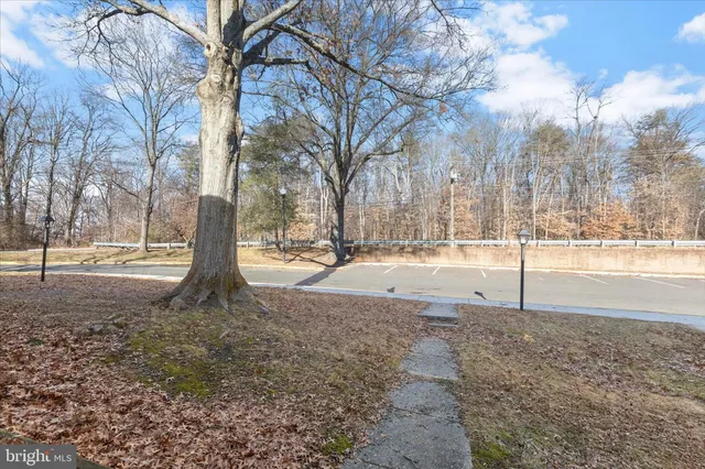 a picture of a building with a white fence