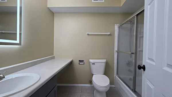 a bathroom with a toilet and a sink