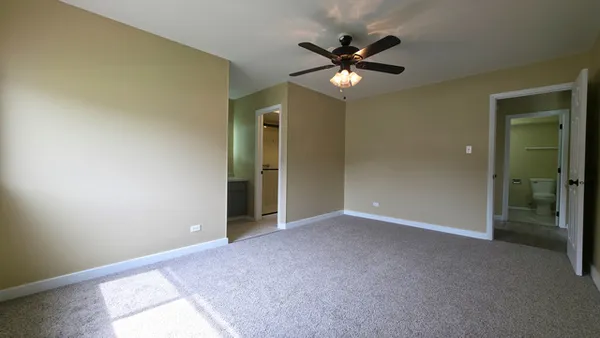an empty room with a bathroom