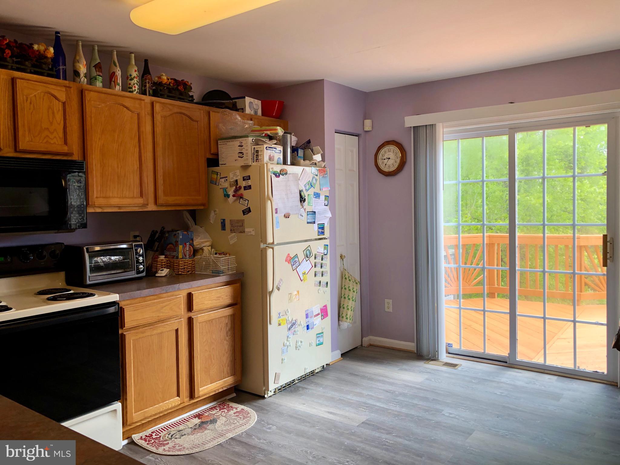 3201 Kelox Road Baltimore, MD 21207 - Photo 8 of 30 Large kitchen with sliding door to a spacious deck