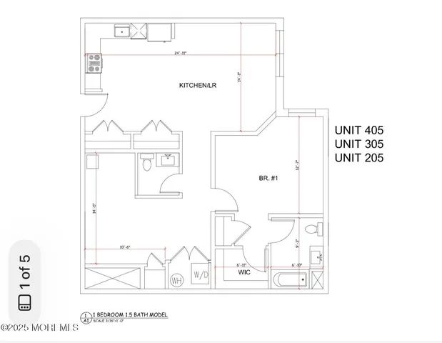 a living room with stainless steel appliances furniture and a large window