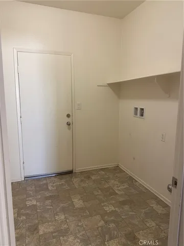 an empty room with a door