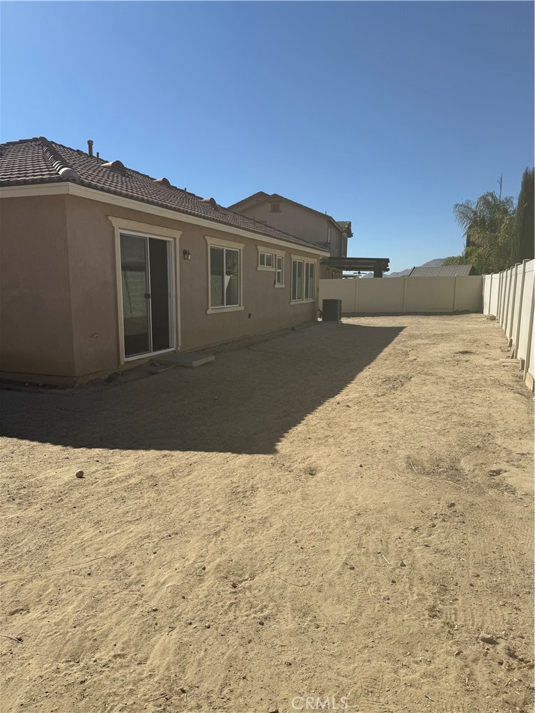 2062 Splendid Circle San Jacinto, CA 92582 - Photo 16 of 18 a view of house with yard and car parked
