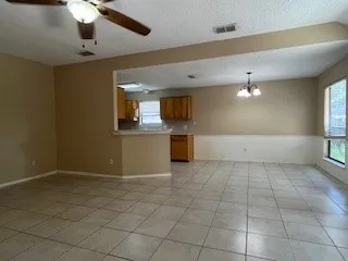 a view of a kitchen with a sink and cabinets