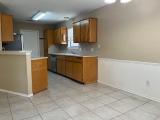 2226 Pebble Beach Drive Ingleside, TX 78362 - Photo 25 of 36 a kitchen with stainless steel appliances granite countertop a refrigerator sink and microwave