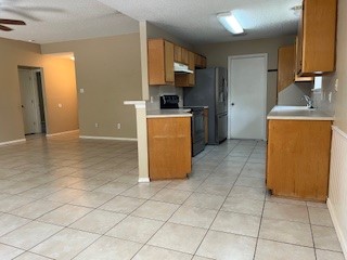 2226 Pebble Beach Drive Ingleside, TX 78362 - Photo 26 of 36 a kitchen with a sink a counter top space and cabinets