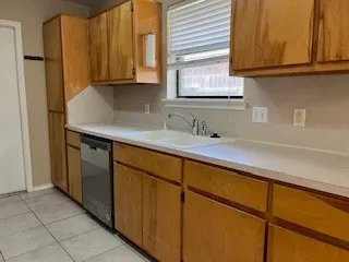 a kitchen with stainless steel appliances granite countertop a sink and a cabinets