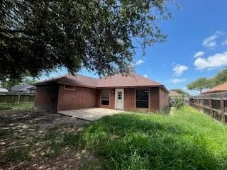 a front view of house with yard and trees