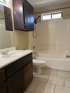a bathroom with a sink a toilet and bathtub
