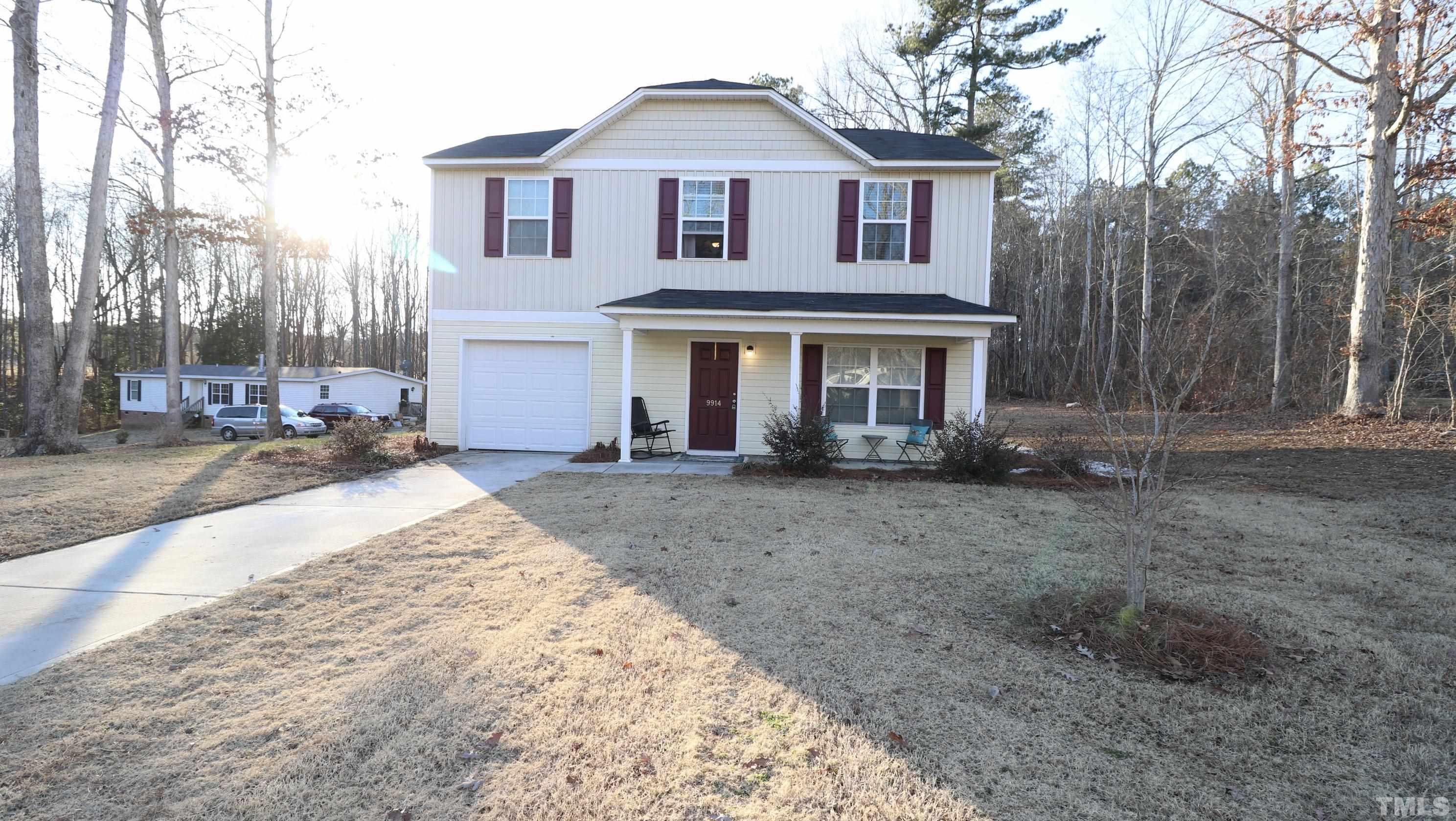 9914 Nugget Road Spring Hope, NC 27882 - Photo 9 of 10 a front view of a house with a yard