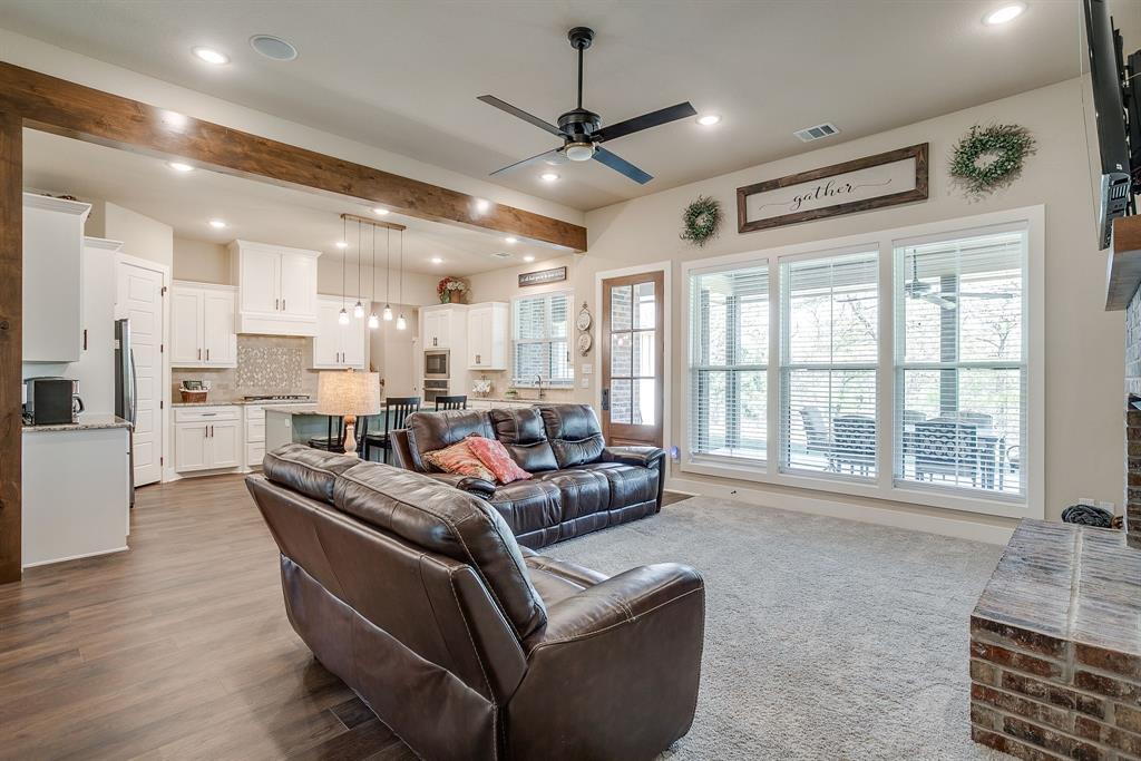 322 Mountainview Court Sunset, TX 76270 - Photo 21 of 40 a living room with furniture and a large window