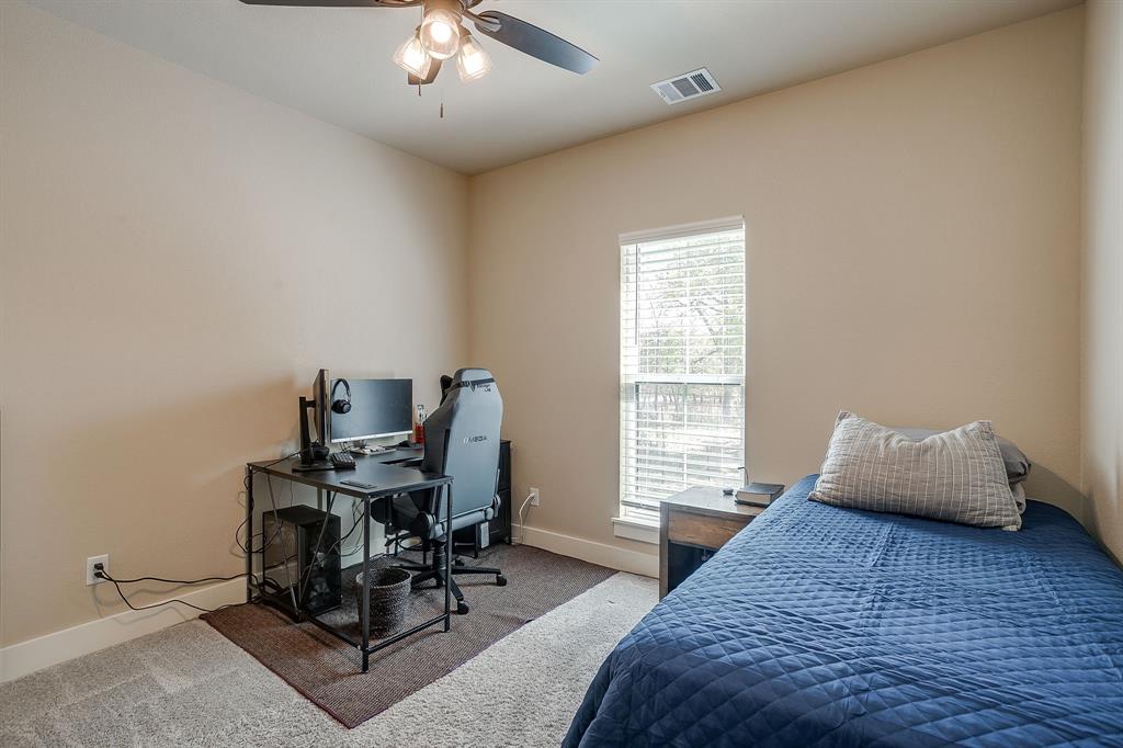 322 Mountainview Court Sunset, TX 76270 - Photo 28 of 40 a bedroom with furniture and a window