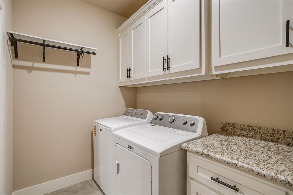 322 Mountainview Court Sunset, TX 76270 - Photo 35 of 40 a utility room with dryer and washer