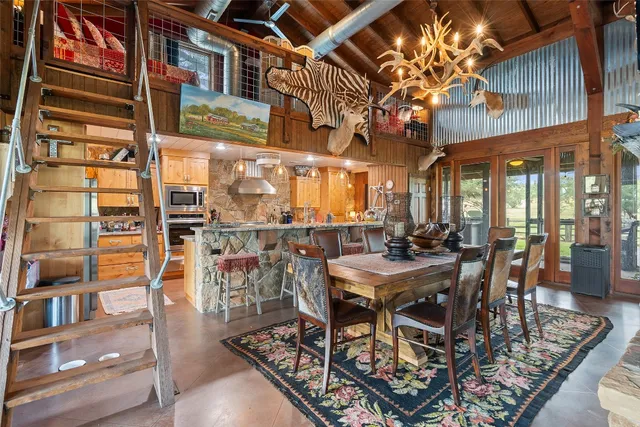 a view of a dining table and chairs in the patio