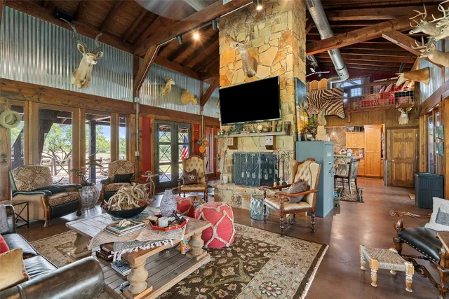 a kitchen with stainless steel appliances granite countertop a sink a stove and a refrigerator