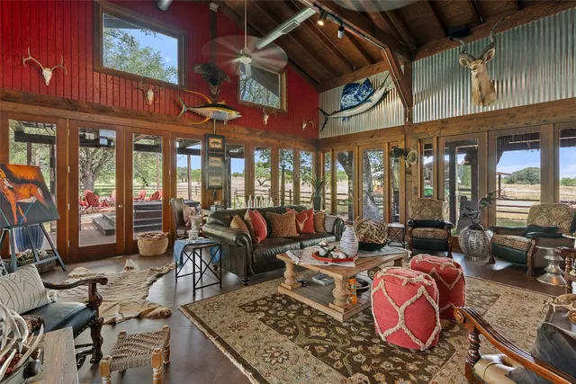 a view of a patio with a table chairs and a backyard