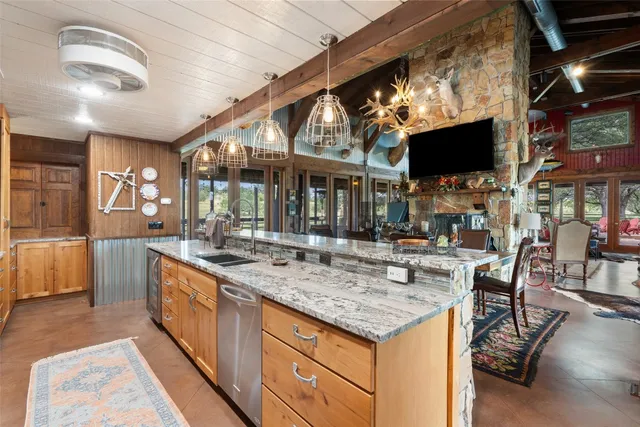 a view of a house with a yard and tree s