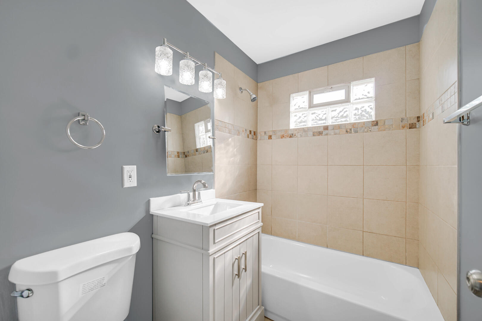 1159 Fayette Street Gary, IN 46403 - Photo 12 of 19 a bathroom with a sink a toilet and a bathtub